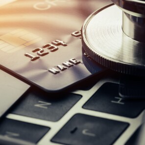 Stethoscope on top of keyboard with credit cards