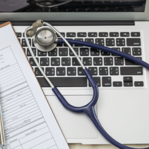 Laptop with stethoscope and medical chart