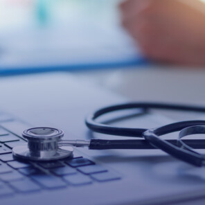 Stethoscope on keyboard of laptop